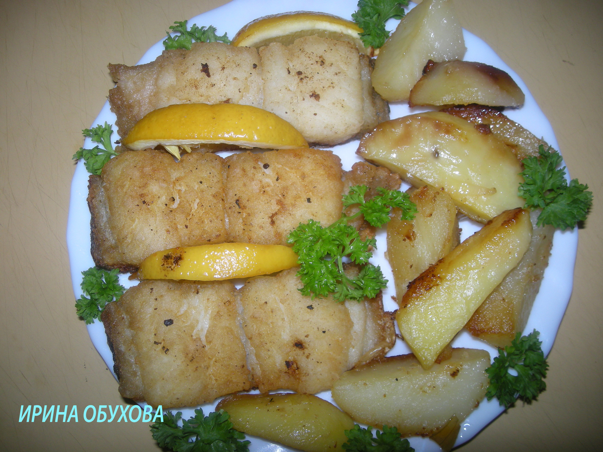 Фото к рецепту: Сом с лимоном и картофелем